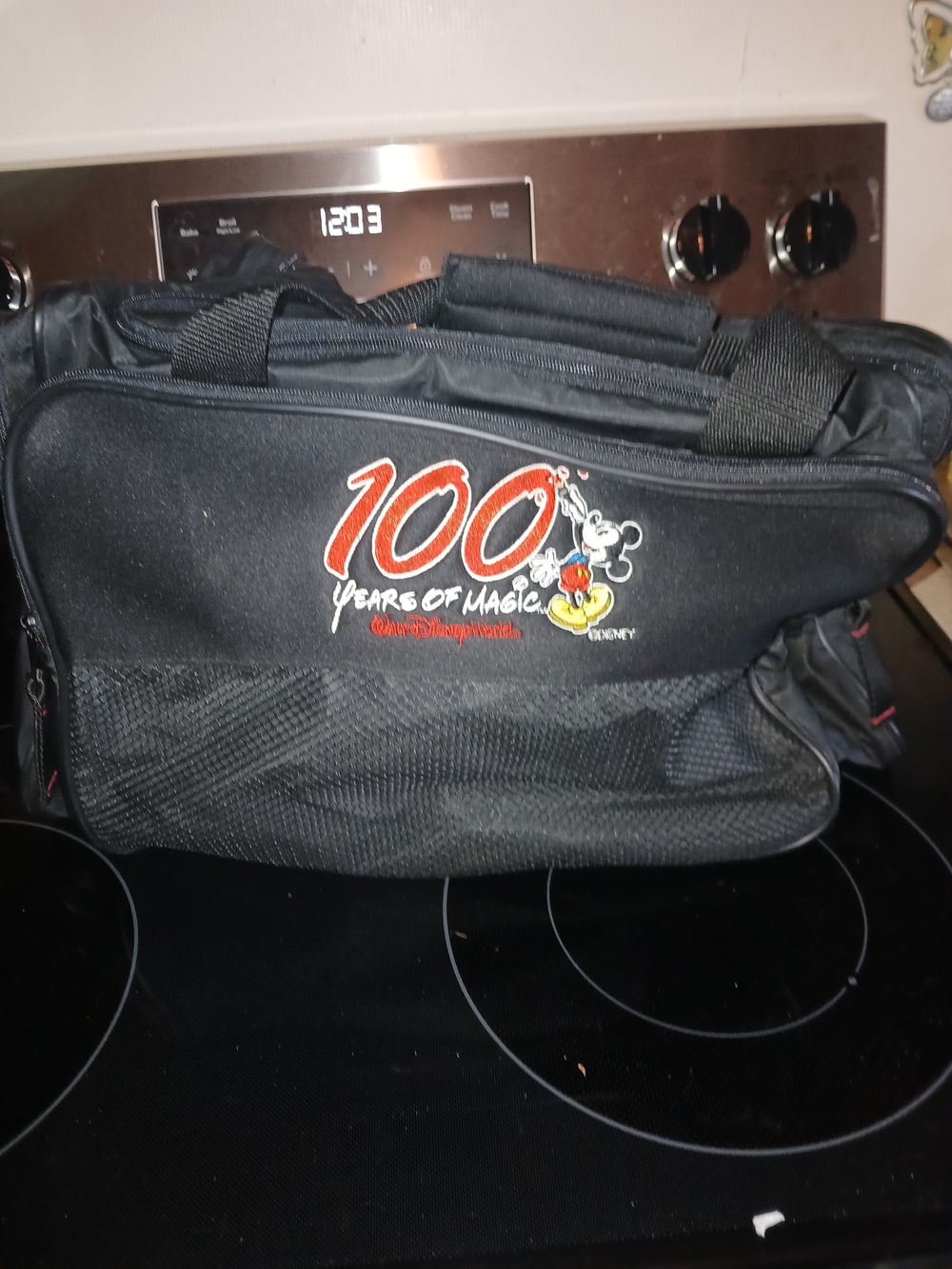 Disney Black Travel Bag with Red and White '100 Years of Magic' Graphic